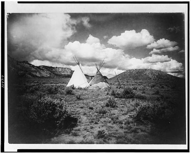 Two Apache Indian teepees in a hilly landscape in Arizona